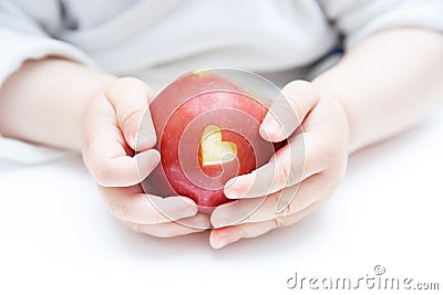 Baby hands with apple isolated on white Stock Photo