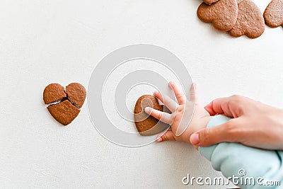 Baby hands, fragile heart, health care, love and family concept, world heart day Stock Photo