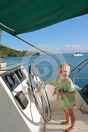 Baby at helm Stock Photo