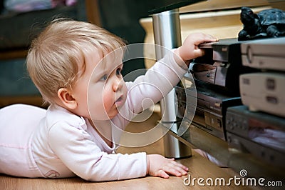 Baby with home video Stock Photo