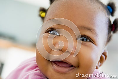 Baby indoors smiling Stock Photo