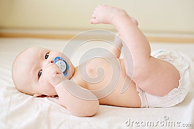 Baby infant boy on the bed Stock Photo