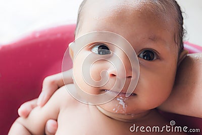 Baby Infant not feeling well and vomiting Stock Photo