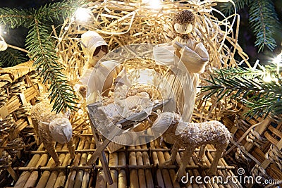 Baby Jesus resting on a manger with light from the star filters through window Stock Photo