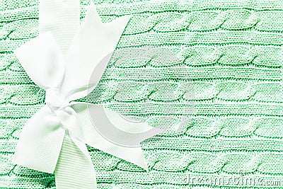 Baby knitted soft green mint blanket with bow for newborn baby Stock Photo