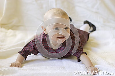 Baby laying on stomach with head up Stock Photo