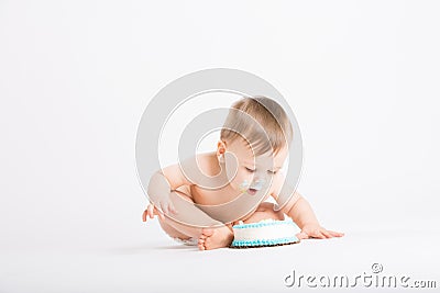 Baby Leans in For Another Bite of Cake Stock Photo