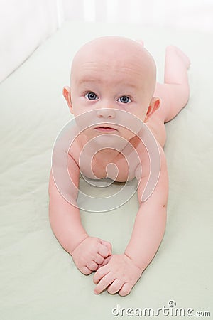 Baby Lying in the Crib Stock Photo