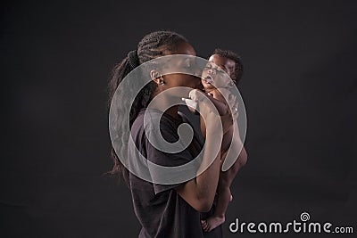 Baby and african american loving mother Stock Photo