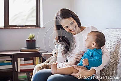 Baby on mother lap Stock Photo