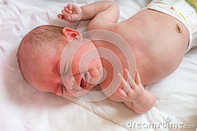 Baby or newborn is crying and suffers from colic Stock Photo