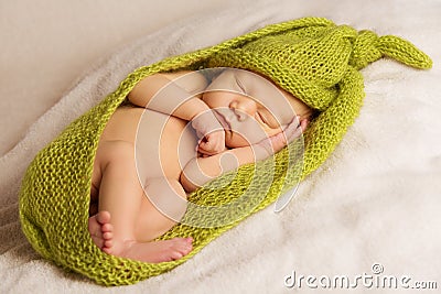 Baby newborn portrait, kid sleeping in woolen Stock Photo