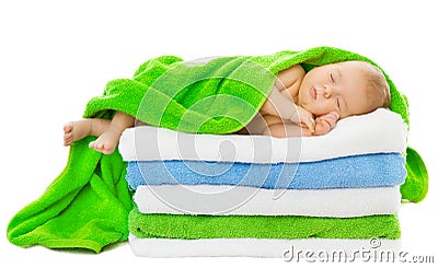 Baby newborn sleeping wrapped in bath towels Stock Photo