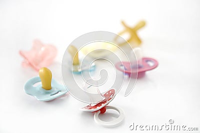 Baby pacifier set over white background Stock Photo