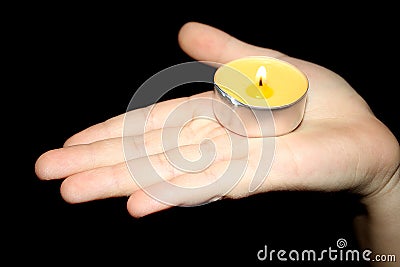 Baby palm candle flame Stock Photo