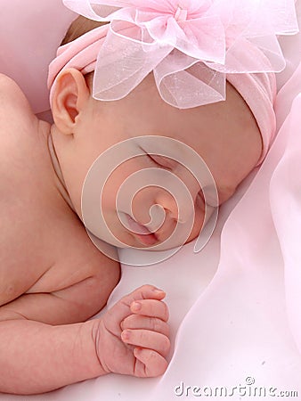 Baby with Pink Bow Stock Photo