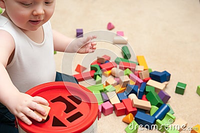 Baby playing with blocks and sorting shapes Stock Photo