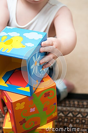 Baby playing with blocks Stock Photo