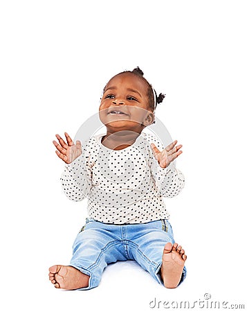 Baby, playing and clapping with smile in studio for applause, fun and cheerful on white background. Child, learning and Stock Photo