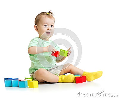 Baby playing with colorful wood building blocks Stock Photo