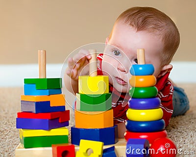 Baby playing with stacking learning toy Stock Photo