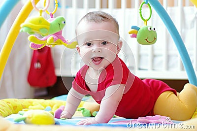 Baby on playmat Stock Photo