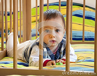 Baby in a playpen Stock Photo