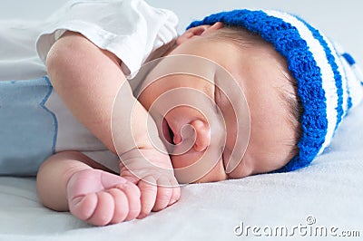 Baby portrait , sleeping newborn in hat on white blanket Stock Photo