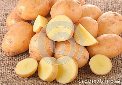 Baby potatoes on gunny sack Stock Photo