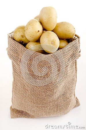 Baby potatoes in a small jute bag Stock Photo