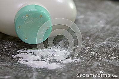 Baby powder on dark brown table Stock Photo