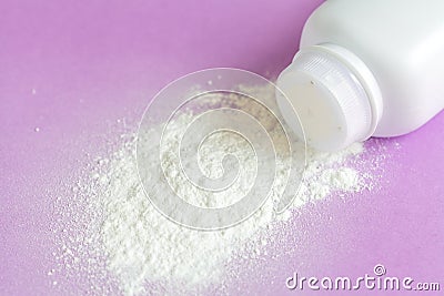 Baby powder on purple background Stock Photo
