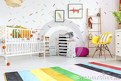 Baby room with yellow chair Stock Photo