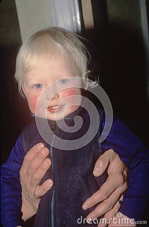 A baby with rosy cheeks Editorial Stock Photo