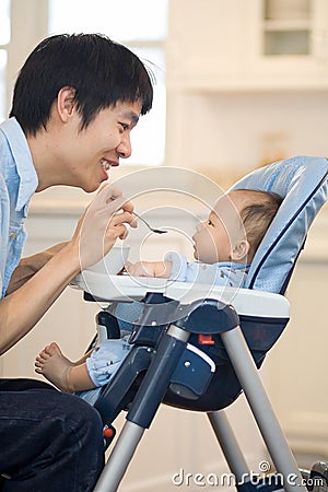 Baby's First Solid Food Stock Photo