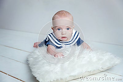 Baby sailor on the white pillow Stock Photo