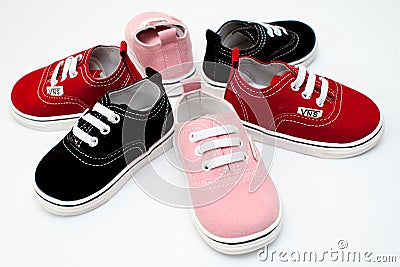 Baby shoes, kids, parent, blue, boy, sneakers, toy, copyspace, wooden Editorial Stock Photo