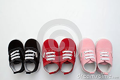 Baby shoes, kids, parent, blue, boy, sneakers, toy, copyspace, wooden Editorial Stock Photo