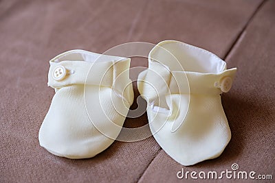 Baby shoes for baptize Stock Photo