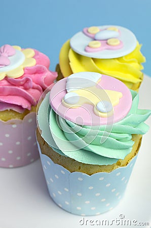 Baby shower or childrens pink, aqua & yellow cupcakes - close up pram Stock Photo