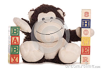 Baby shower with soft toy monkey Stock Photo