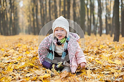 Baby sitting in forest and crying Stock Photo