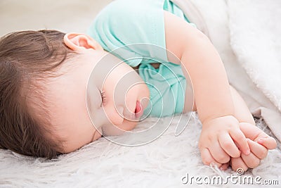 Baby sleep on the bed Stock Photo