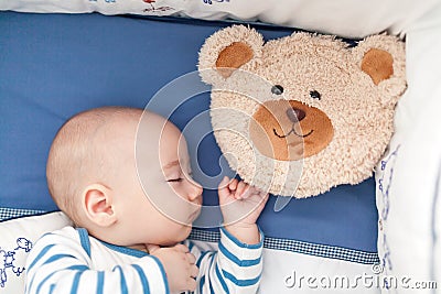 Baby sleeping with a pillow Stock Photo
