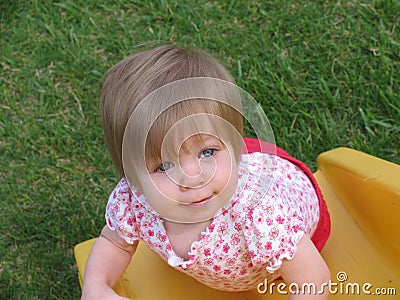 Baby on slide Stock Photo