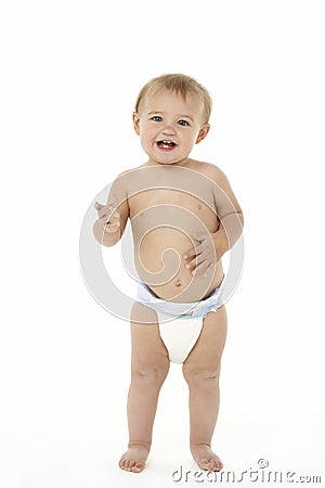 Baby Smiling And Standing Stock Photo