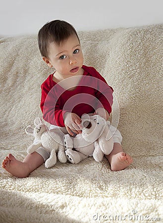 Baby with soft toys Stock Photo