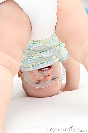 Baby standing on head Stock Photo