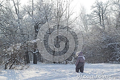 Baby step against snow forest winter oudoors Stock Photo