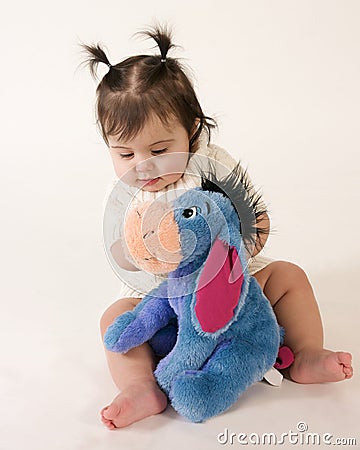Baby with stuffed animal Stock Photo